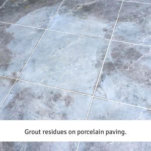 Grout residues on porcelain paving.