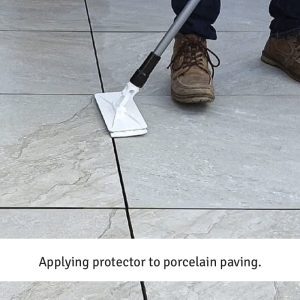 Applying protector to porcelain paving.